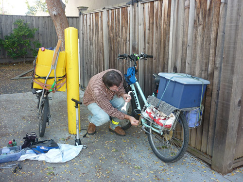 Tom Kabat's bicycle repair shop at Transition Palo Alto's Holiday Sharing Expo. Photo by Sven Eberlein