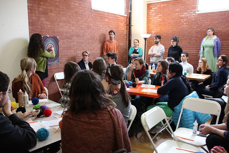 A group of learners listening intently. Photo credit: Paula Junn.