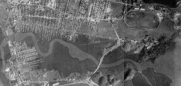 An aerial view of the Martín Peña Canal in the 1930s, showing the extent of mangrove swamps that once lined the canal. An aerial view of the Martín Peña Canal in the 1930s, showing the extent of mangrove swamps that once lined the canal.