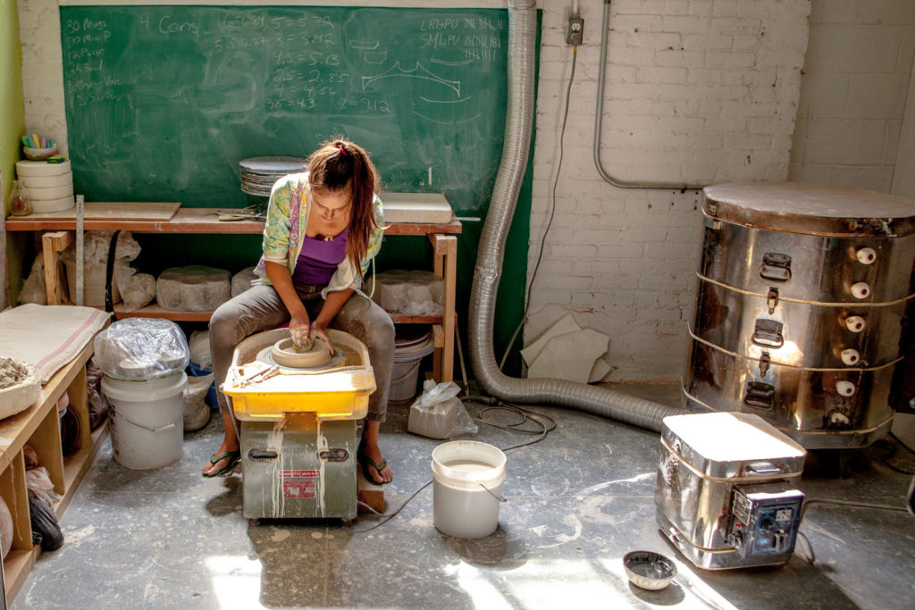 Brooke Winfrey works at her former studio in Brooklyn.jpg