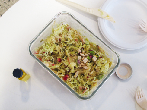 Raw portion of Ines's meal with Marisol (veggies, seeds/nuts, & a blended mango, lemon, olive oil dressing).