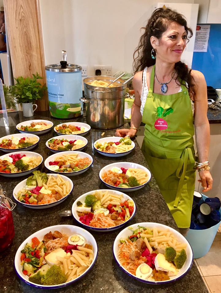 Volunteer helping at a Food in Community cafe