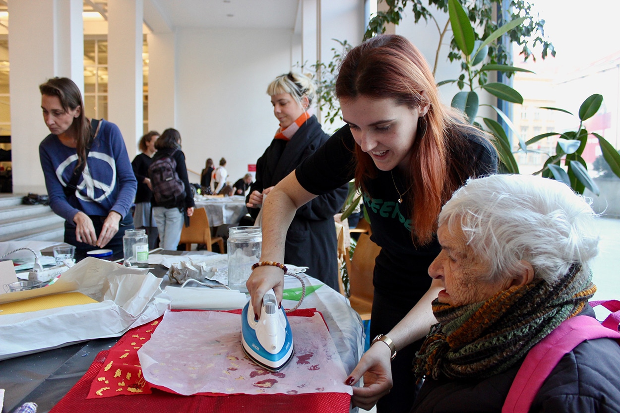Two women ironing
