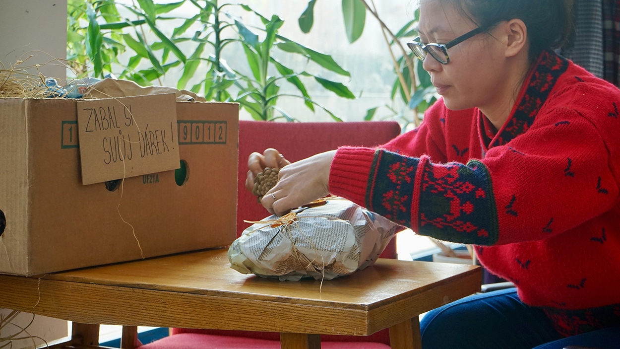 women wrapping a gift