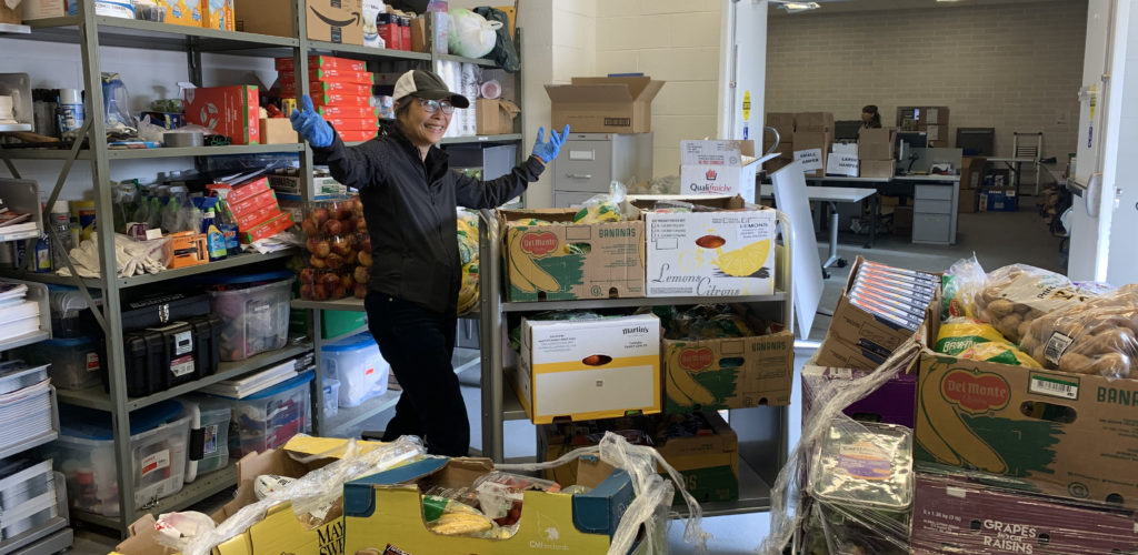 Toronto Public Library (TPL) staff members prepare for a food distribution day at the library's Ellesmere Distribution Centre. Photos courtesy of Michelle Leung, TPL.