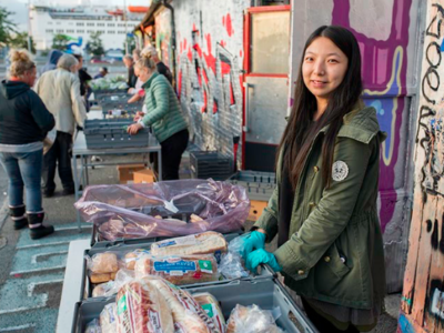 A Solikyl volunteer waits for someone to approach her table. Photo credit: Rikard Rensfelt