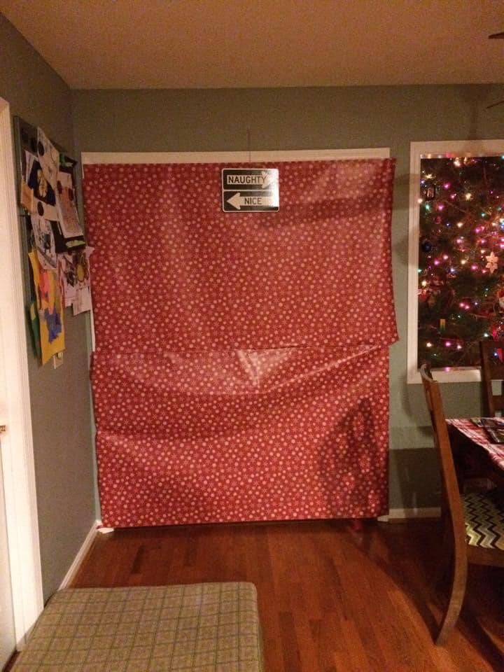 A doorway covered in wrapping paper is one no-spend tradition one family uses during the holiday season. Credit: Amy Lantz