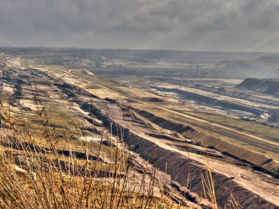 smoky, brown open coal mine