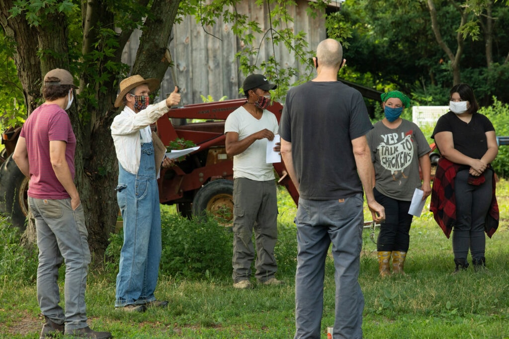 group of farmers standing together talking