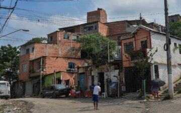 View of the main entrance of Vila Nova Esperanca, a 'green favela' that utilizes the principles of permaculture and fights to be a model of sustainable living (Sao Paulo, Brazil - Feb 2020) Credit: Nelson Almeida - sustainable housing