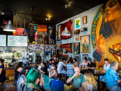 Patrons dine inside ¡Salud Tacos!, a " hip, casual Mexican eatery" located in San Diego, CA.