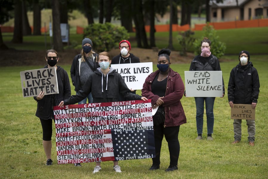 just transition: Masked demonstrators gather with signs at a Southwest Washington Communities United for Change rally at Vancouver Central Park. June 2020. Credit: Amanda Cowan for The Columbian