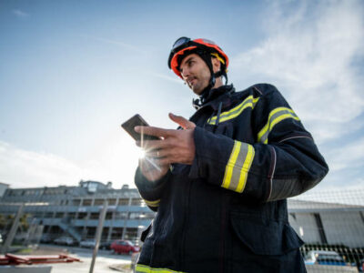 Watch Duty- Firefighters in a rescue operation training, holding a cellphone