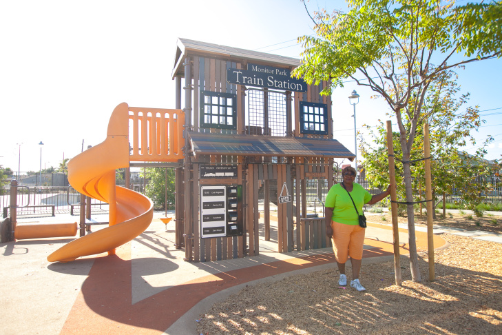 Community member Lottie Cleveland poses at the then newly-completed Serenity Park in Watts, 2016. Credit: KPCC