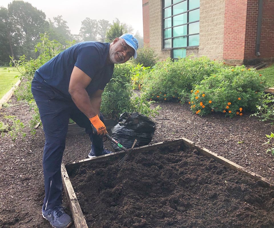 food insecurity | A community gardener at work on his plot at the Walkertown branch of the Forsyth County Public Library, North Carolina. Photo credit: Natalia Tuchina