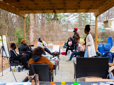 Members of Endstate ATL gather for a community meeting. ESA is one faction of a growing collective of Black Atlantan movement builders championing collective liberation through (among other strategies) solidarity economics. Credit: Endstate ATL