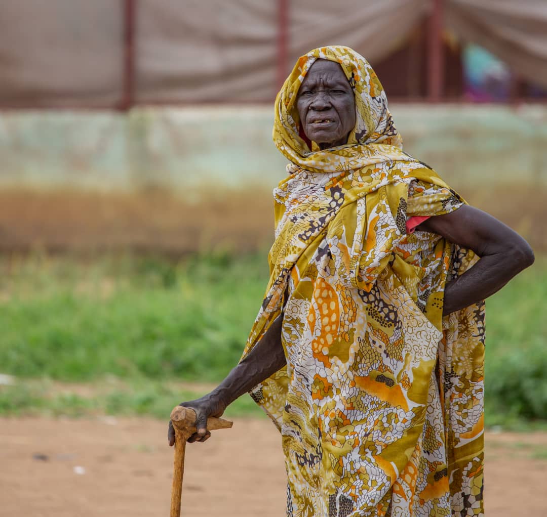 A Sudanese woman poses for a photograph